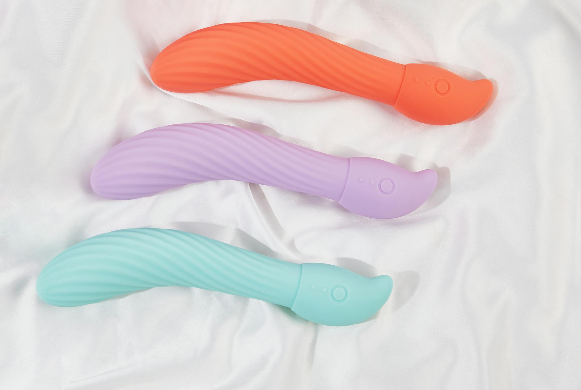 A couple holding a blue vibrator together, representing modern intimacy and shared pleasure in a relationship.