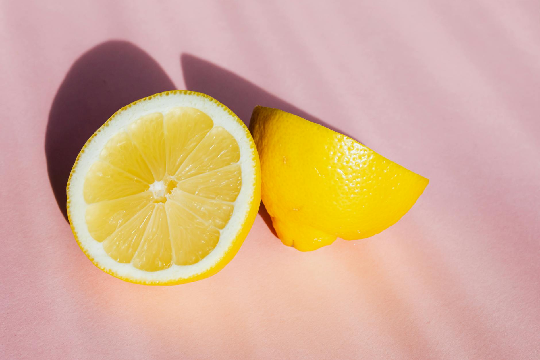 Yellow silicone vibrator surrounded by peeled bananas on a yellow background