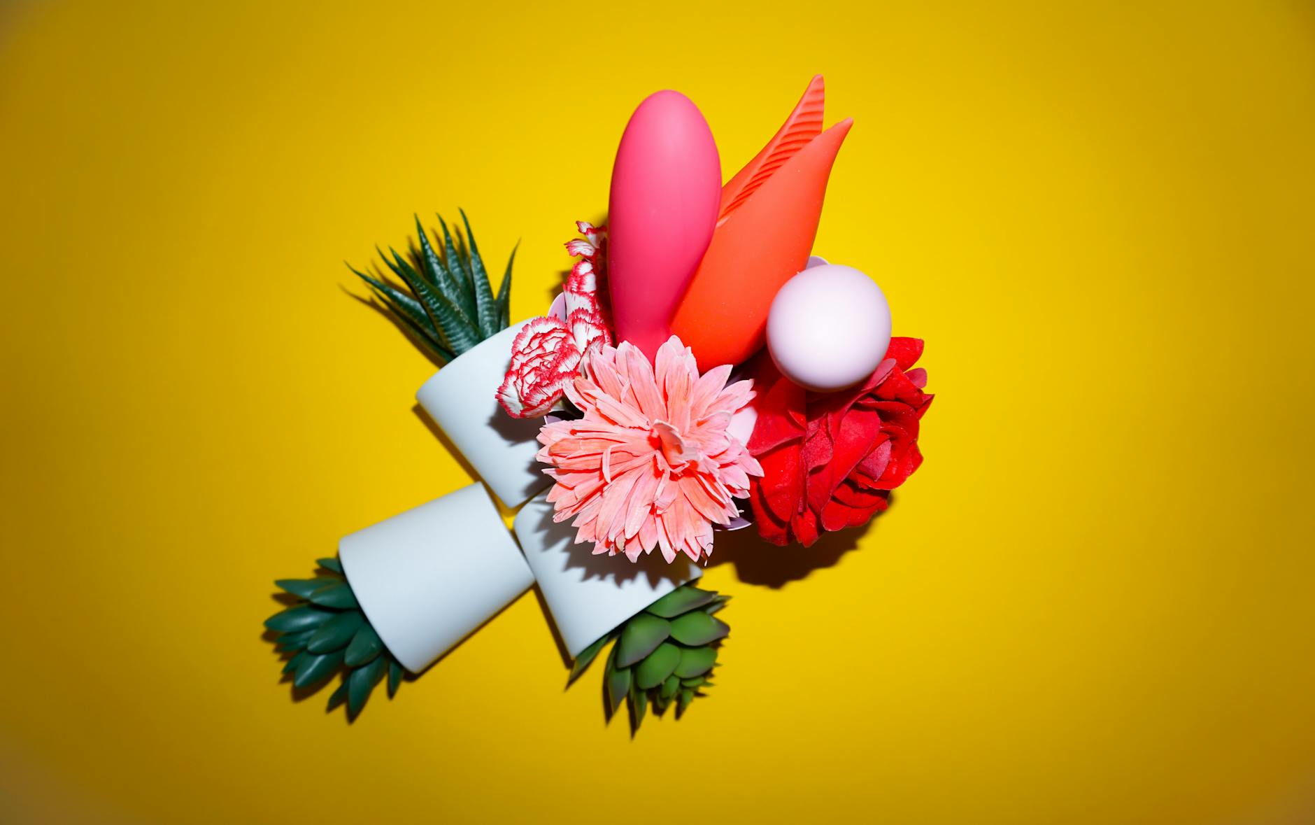 Woman holding silicone vibrators, exploring comfort and sensitivity